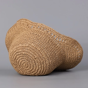 Handmade woven straw sun hat with round crown and镂空hollow decorative edge design