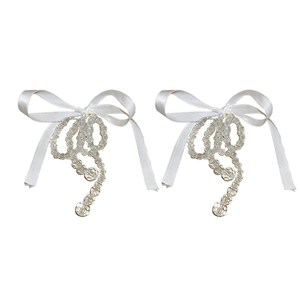 Elegant fabric bow earrings with clear glass beads and gold plating in a minimalist style