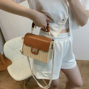 Minimalist straw box handbag with pleated brown leather handle and rope shoulder strap