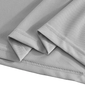 Detailed macro view of light grey piqué fabric with double-needle stitching on the hem