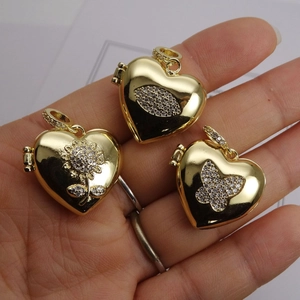 Gold-plated heart locket pendants with sunflower and butterfly cubic zirconia engravings