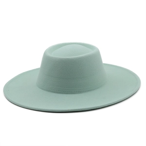 Close-up of mint green wool fedora hat with wide brim and fine stitching detail