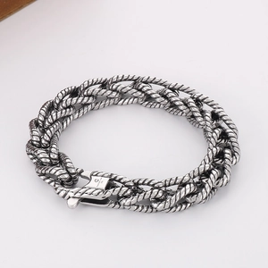Detailed view of punk style braided titanium steel bracelet with vintage silver finish