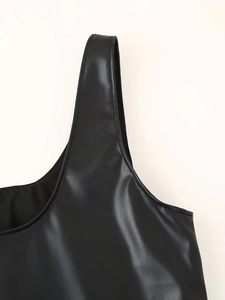 Close-up of the black PU leather strap and neckline texture of the vintage slip dress