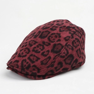 Detail view of deep red leopard print beret with thick faux suede texture for winter