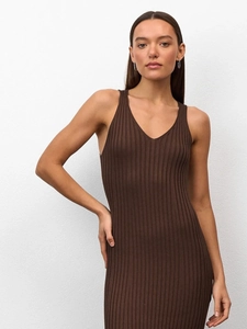Detail of slim fit dark brown knitted maxi dress with vertical ribbed texture and V-neckline