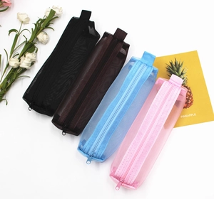 Row of mesh pencil cases in black, brown, blue, and pink colors on white background