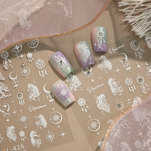 Unicorn and dreamcatcher nail stickers with star and moon patterns on gradient nails