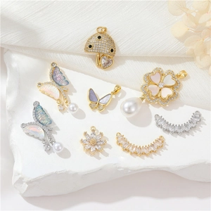 Group of 14k gold and silver plated butterfly and flower pendants with cubic zirconia