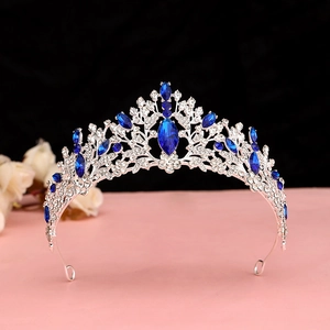 Detail of silver tiara with deep blue crystals and rhinestones for bridal hairstyle