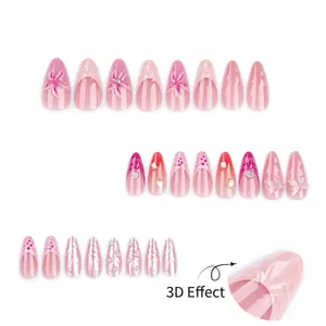 Faux ongles 3D avec dégradé rose, papillons et décorations de fleurs perlées