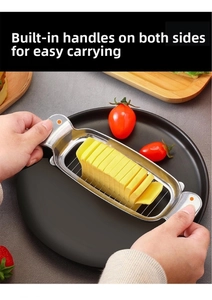 Detail of stainless steel wire cutter slicing butter with convenient side handles