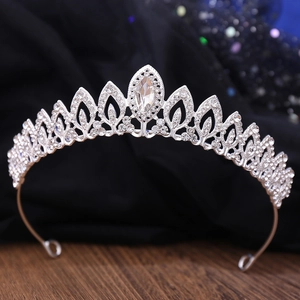 Detailed close-up of a leaf-shaped silver bridal tiara with sparkling rhinestones