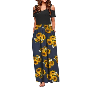 Detail of sunflower digital print on a long casual dress with an off-shoulder design