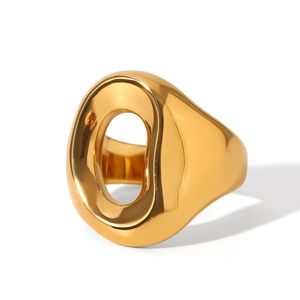 Macro detail of polished gold hollow ring showing the smooth geometric croissant design