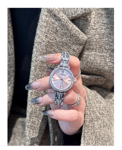 Elegant women's watch featuring a pink sunray dial with crystal bezel and silver metal strap