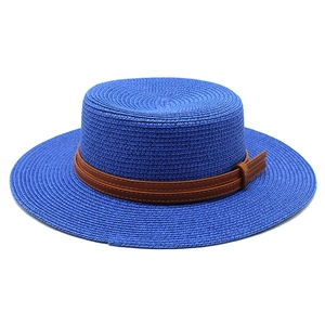 Detail of royal blue boater hat weave with double-layered brown leather band accent