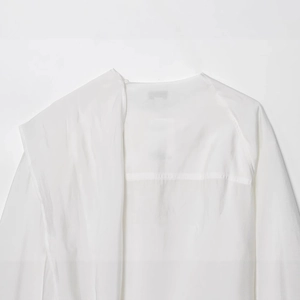Minimalist white long-sleeved casual blouse with premium natural textured fabric