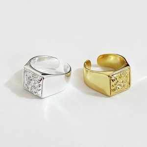 Lava texture rectangular signet rings in polished silver and gold with open bands