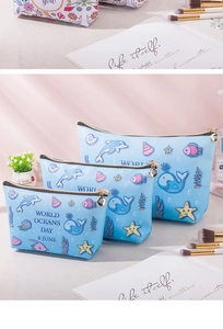 Three-piece ocean-themed waterproof PU makeup bag set featuring whale and dolphin prints