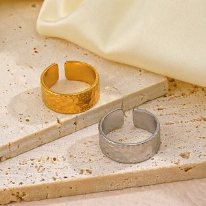 Adjustable wide stainless steel open rings with gold and silver hammered finish details