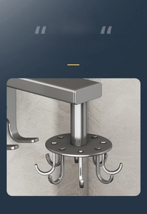 Detail of grey matte rotating kitchen rack with hooks for spoons and spatulas