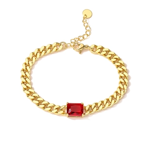Detailed shot of 18K gold-plated Cuban chain bracelet with a red rectangular zircon gem