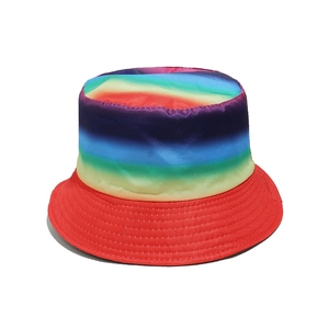 Close-up of rainbow gradient bucket hat featuring a silk-like texture and red stitched brim