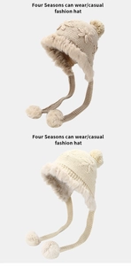 Detail of knit earflap hats with fluffy faux fur trim and pom-poms in beige and cream