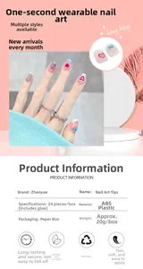 Detailed close-up of pink translucent press-on nails with heart and bow-knot decorations