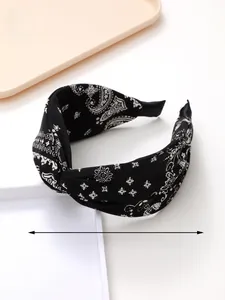 Detail of paisley print headband showing twist knot design and 39cm circumference size