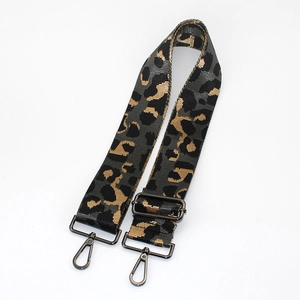 Close-up of leopard jacquard strap with gunmetal lobster claw clasps and adjustable buckle