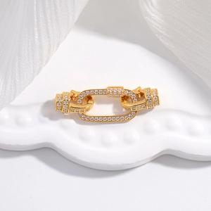 Macro shot of gold S925 sterling silver connector clasp set with white zircon stones