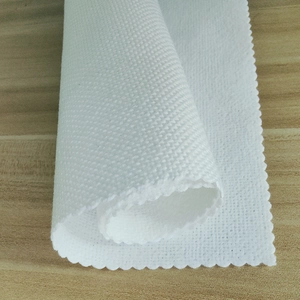 White linen placemat with textured weave and wavy edges for Halloween table decoration