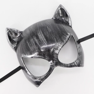 Detail of silver brushed cat mask for masquerade party showing metallic texture and ribbons