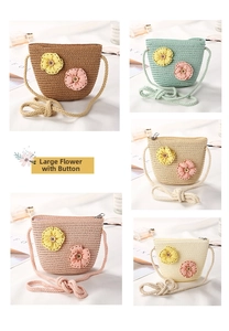 Close-up of woven straw bucket bags with floral decorations and zipper closure
