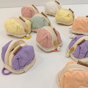 Pastel quilted mini pouches for earbuds with pearl zipper charm and vibrant colors