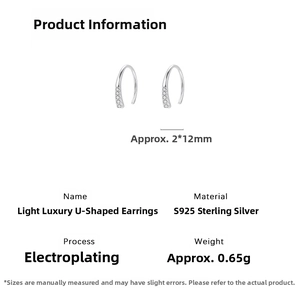 Macro detail of S925 sterling silver U-shaped hook earrings with inlaid cubic zirconia