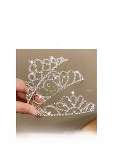 Detailed view of silver rhinestone tiaras with intricate crystal patterns for women