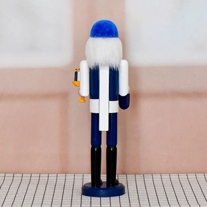 Rear view of 36cm blue and white wooden Hanukkah Nutcracker with candle and velvet hat