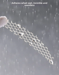 Macro detail of fine mesh lace double eyelid tape with water-activated adhesive