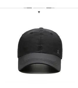 Detail view of lightweight quick-dry black baseball cap with grey S logo and reinforced stitching