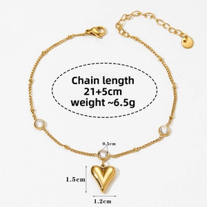 Detail of gold heart pendant anklet with sparkling zircon stones and lobster clasp