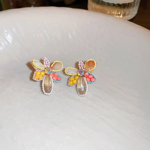 Detailed shot of handmade beaded flower earrings with colorful petals and crystal accent