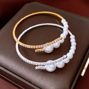 Elegant beaded open bracelet set with faux pearls and rhinestones in gold and silver finish