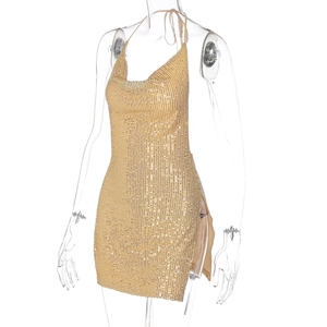 Detailed view of a sexy gold sequin halter mini dress with side slit design on mannequin