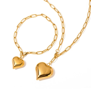 Golden paperclip chain necklace and bracelet set with hollow heart pendant for women