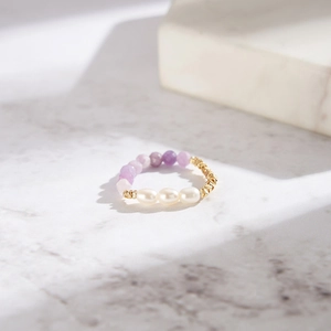 Handmade stretch ring with pink opal purple stones and freshwater pearls on marble