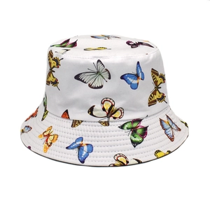 Close-up of colorful butterfly prints on white cotton canvas bucket hat fabric