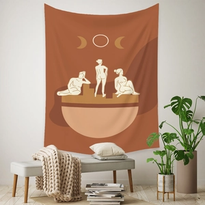 Detail of Bohemian tapestry with female silhouettes and moon phases on a white wall